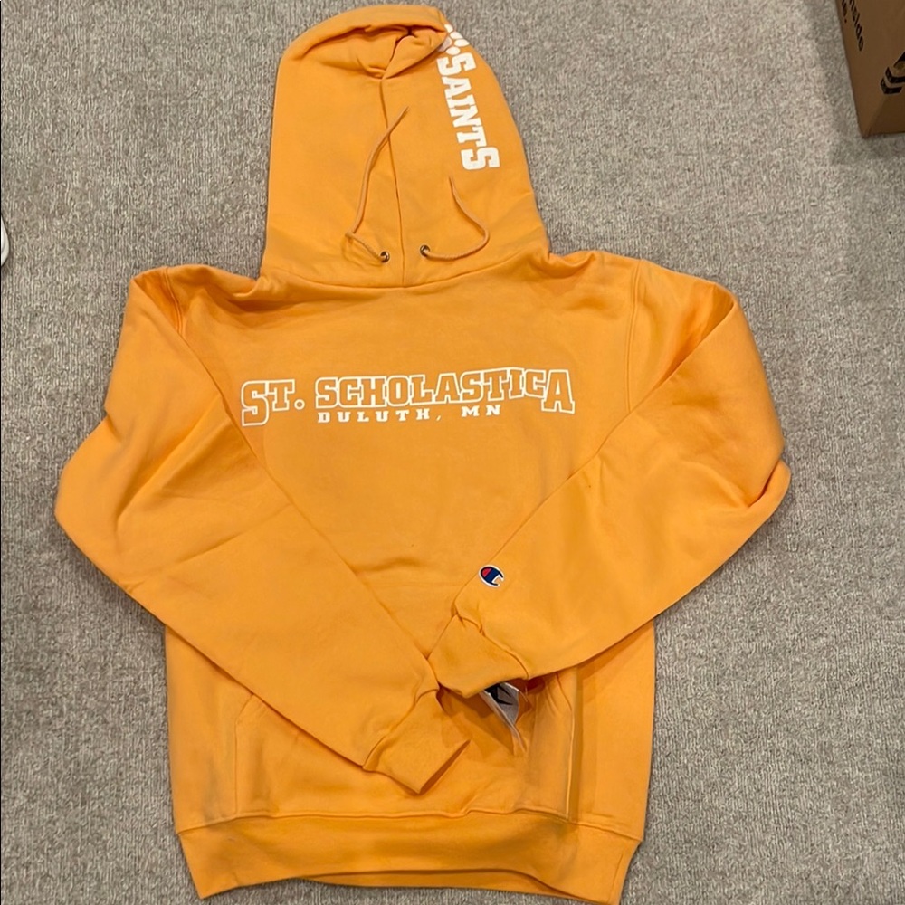 Women’s size small orange St. Scholastica sweatshirt.  New with tags.